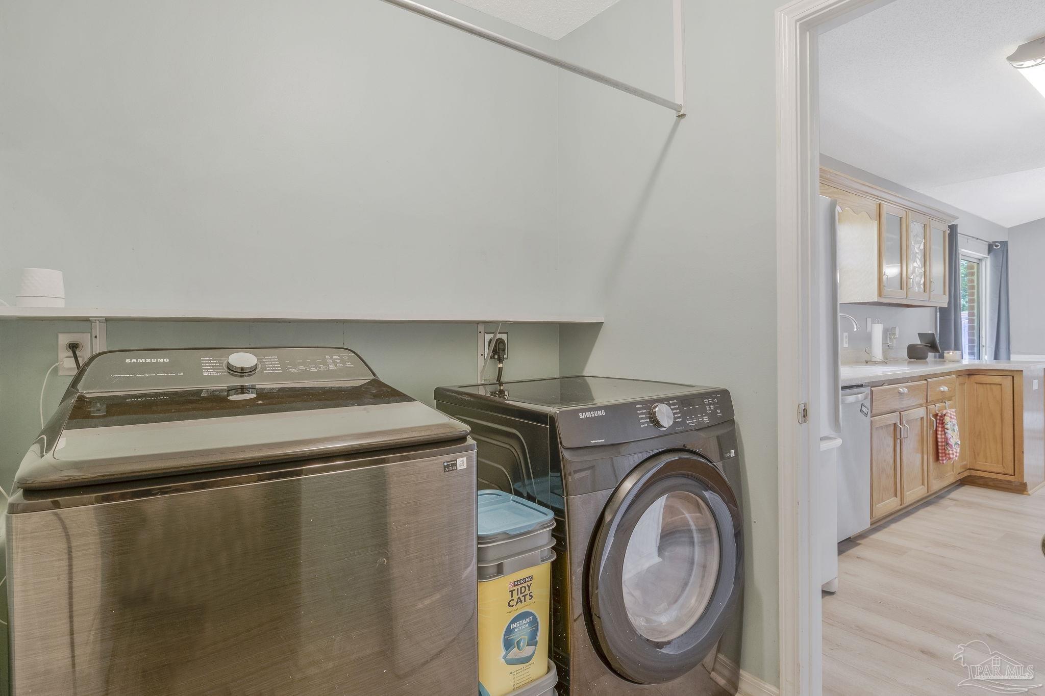 5539 Windrun Place Pace, FL 32571 - Photo 34 of 62 a utility room with dryer and washer