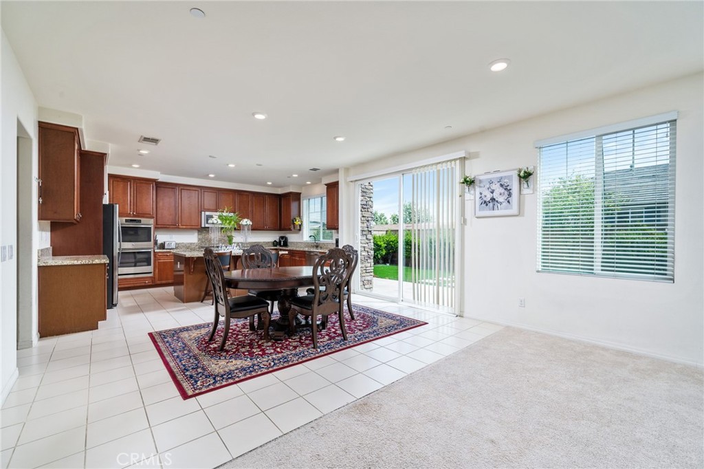 13243 Stanton Drive Rancho Cucamonga, CA 91739 - Photo 13 of 53 a living room with furniture a window and stainless steel appliances