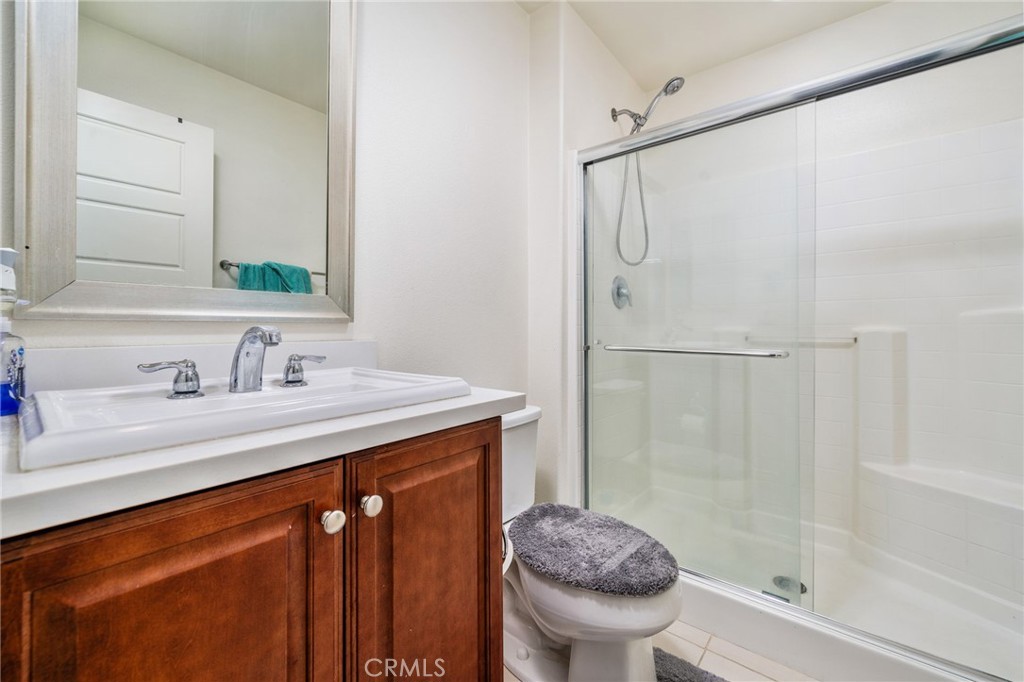 13243 Stanton Drive Rancho Cucamonga, CA 91739 - Photo 20 of 53 a bathroom with a granite countertop sink toilet and shower