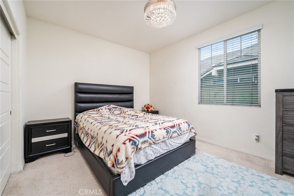 13243 Stanton Drive Rancho Cucamonga, CA 91739 - Photo 21 of 53 a bedroom with a bed and a window