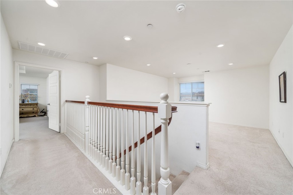 13243 Stanton Drive Rancho Cucamonga, CA 91739 - Photo 22 of 53 a view of a hallway with closet and a bathroom