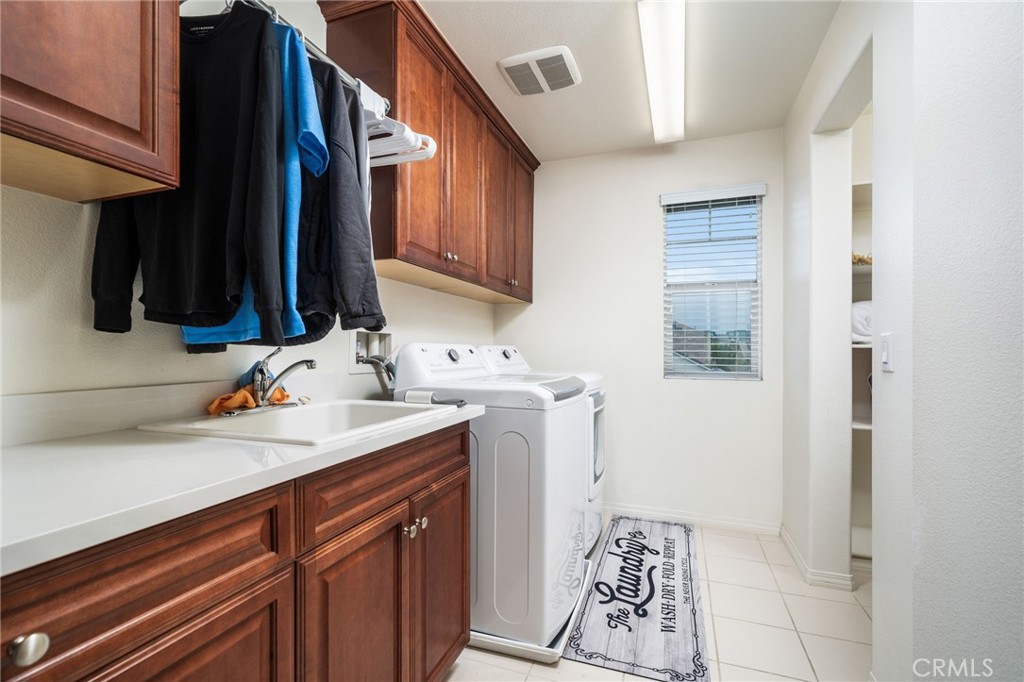 13243 Stanton Drive Rancho Cucamonga, CA 91739 - Photo 24 of 53 a bathroom with a sink and a mirror