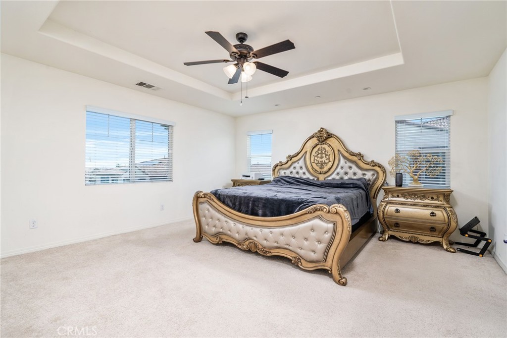 13243 Stanton Drive Rancho Cucamonga, CA 91739 - Photo 29 of 53 a bedroom with a bed and a ceiling fan