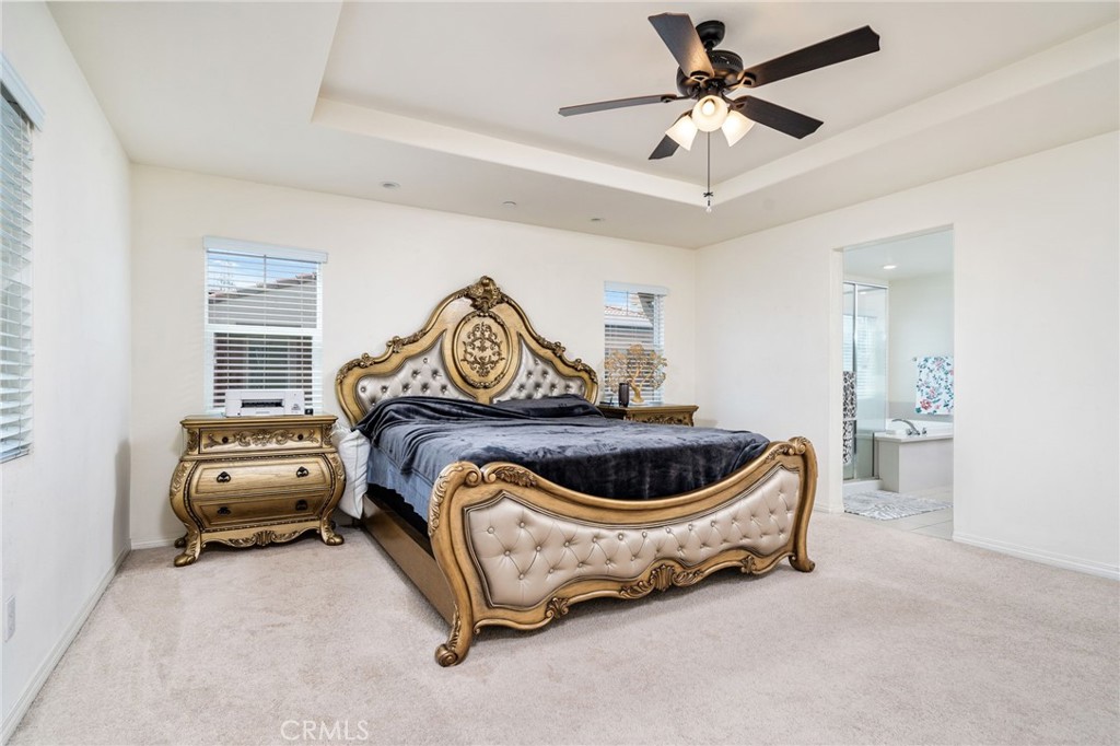 13243 Stanton Drive Rancho Cucamonga, CA 91739 - Photo 30 of 53 a room with a bed and a chandelier