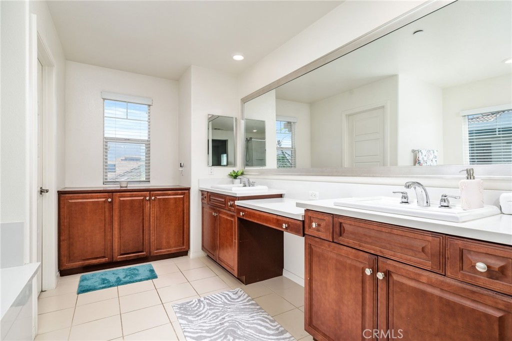 13243 Stanton Drive Rancho Cucamonga, CA 91739 - Photo 31 of 53 a spacious bathroom with a granite countertop sink and mirror