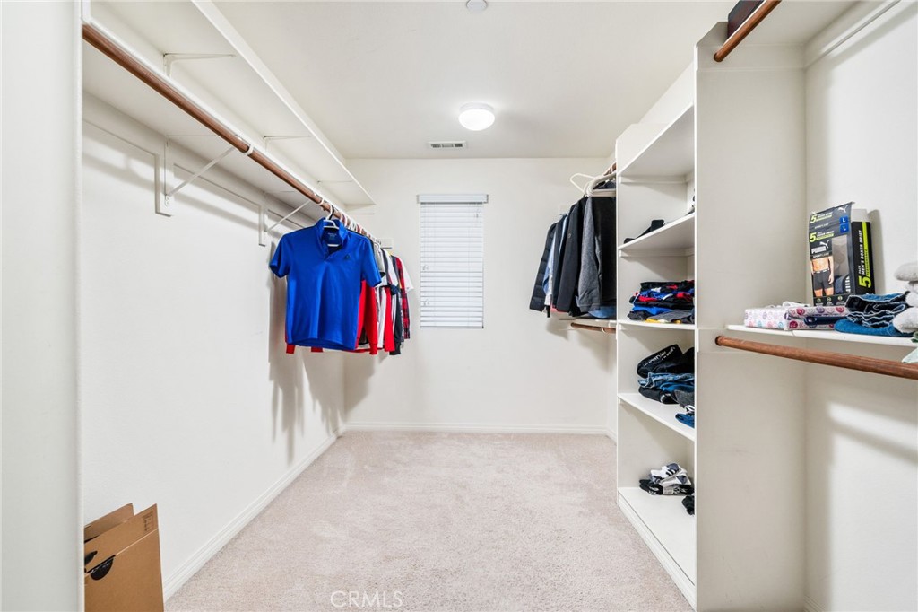 13243 Stanton Drive Rancho Cucamonga, CA 91739 - Photo 33 of 53 a view of walk in closet with clothes and shoes