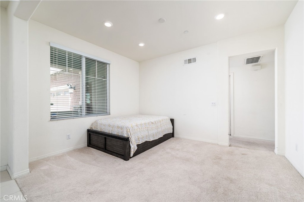 13243 Stanton Drive Rancho Cucamonga, CA 91739 - Photo 9 of 53 a spacious bedroom with a bed and a window