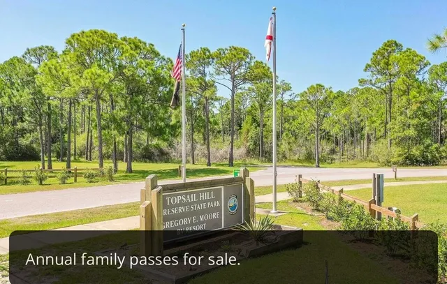 a view of a sign board with an outdoor space