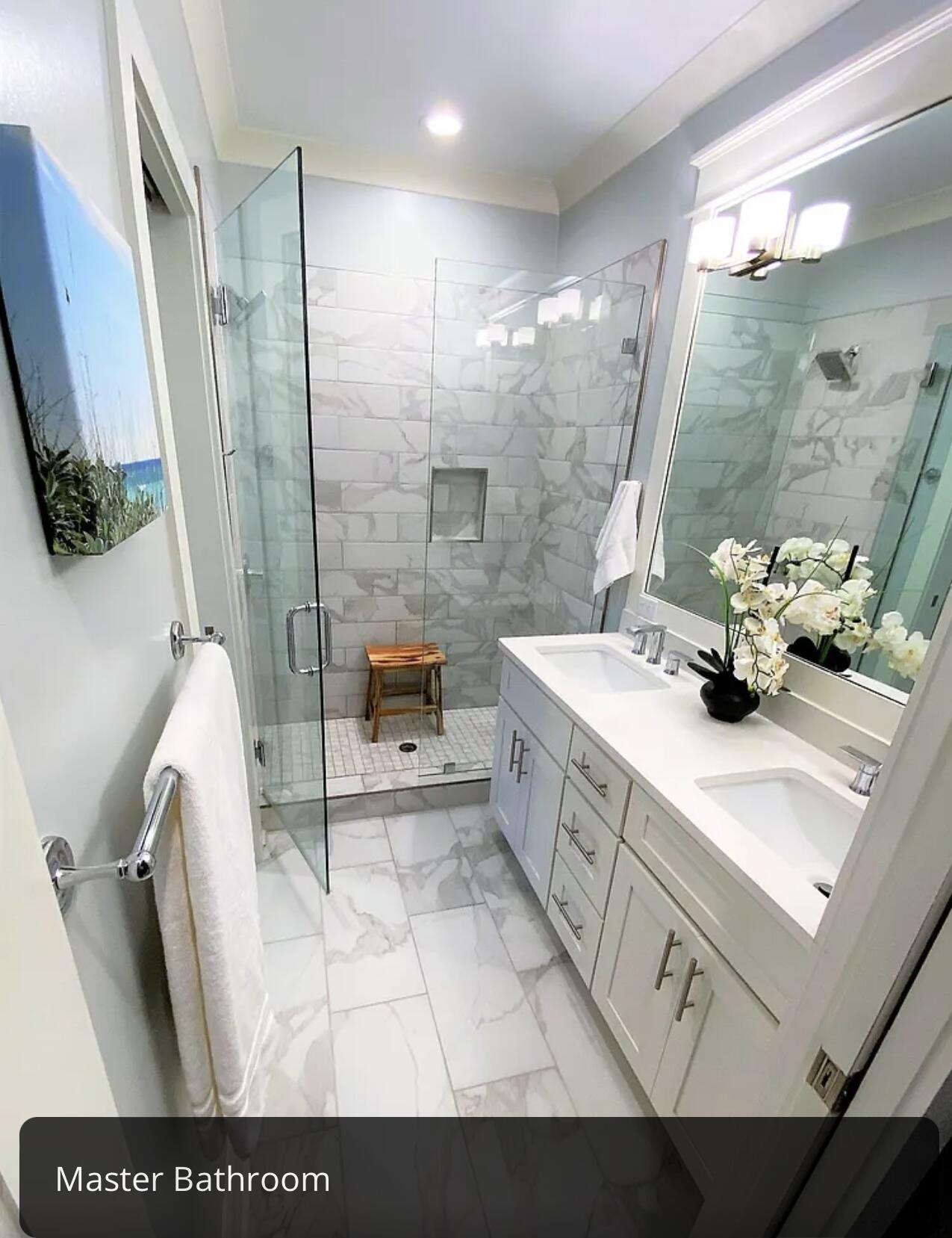 92 Heron's Crossing Santa Rosa Beach, FL 32459 - Photo 9 of 28 a bathroom with a sink a toilet a mirror and shower