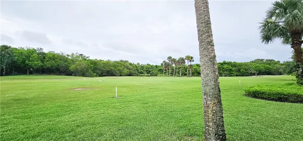 a view of a golf course with a lake