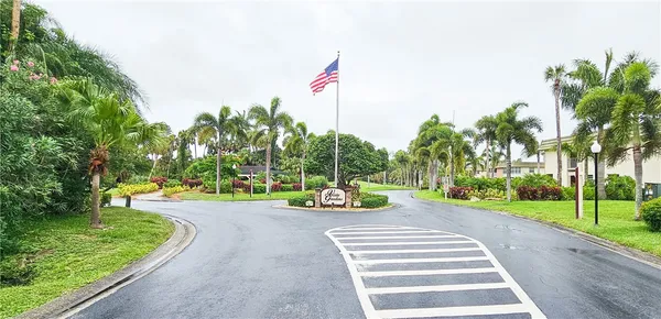 a sign on the side of the tree