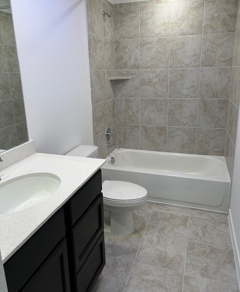 125 Watkinville Road Hutto, TX 78634 - Photo 12 of 17 a bathroom with a sink a toilet and bathtub