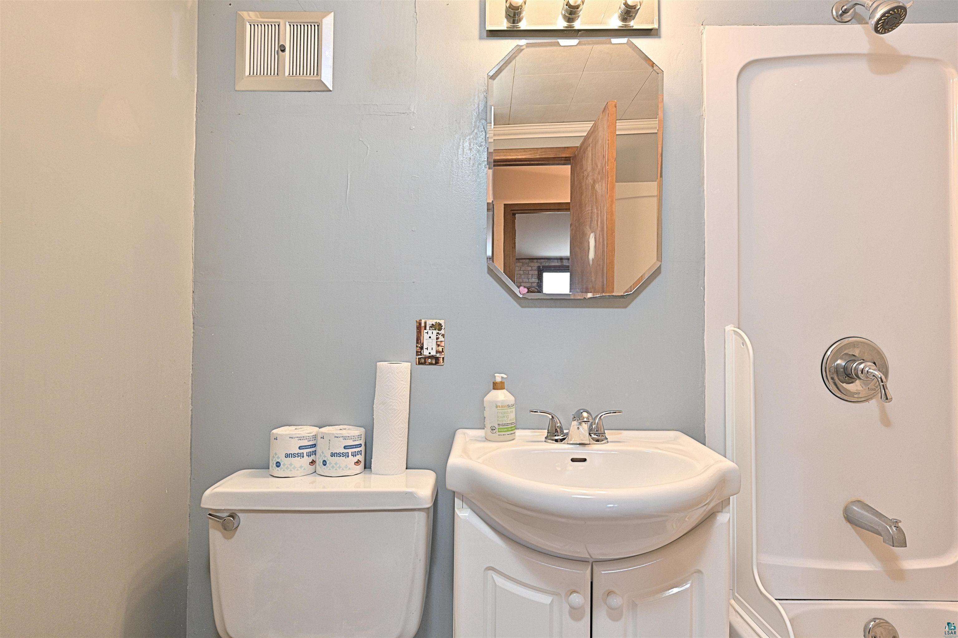 18 Banks Boulevard Silver Bay, MN 55614 - Photo 13 of 26 Bathroom featuring vanity and shower combination