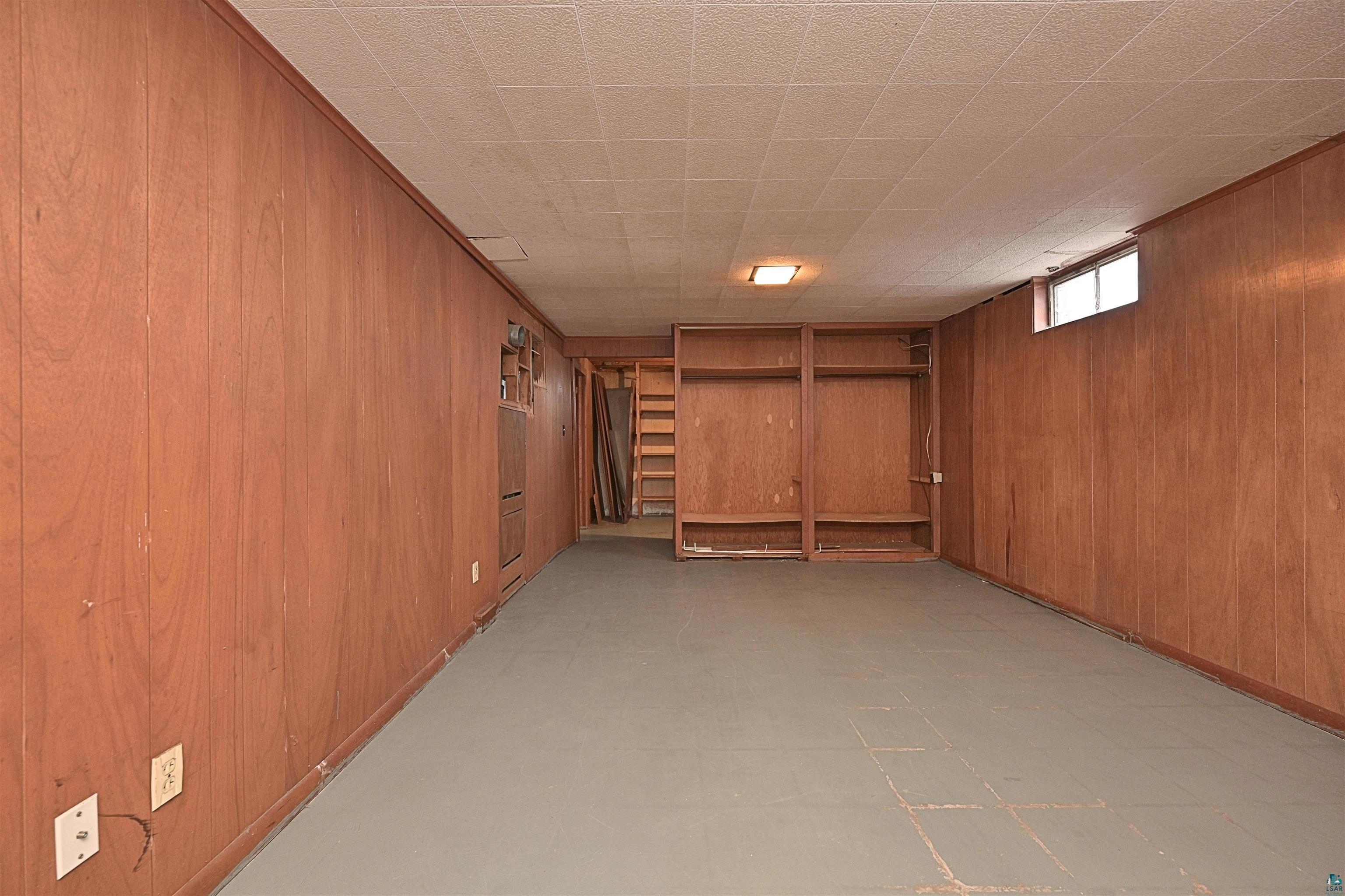 18 Banks Boulevard Silver Bay, MN 55614 - Photo 14 of 26 Basement featuring light flooring and wooden walls
