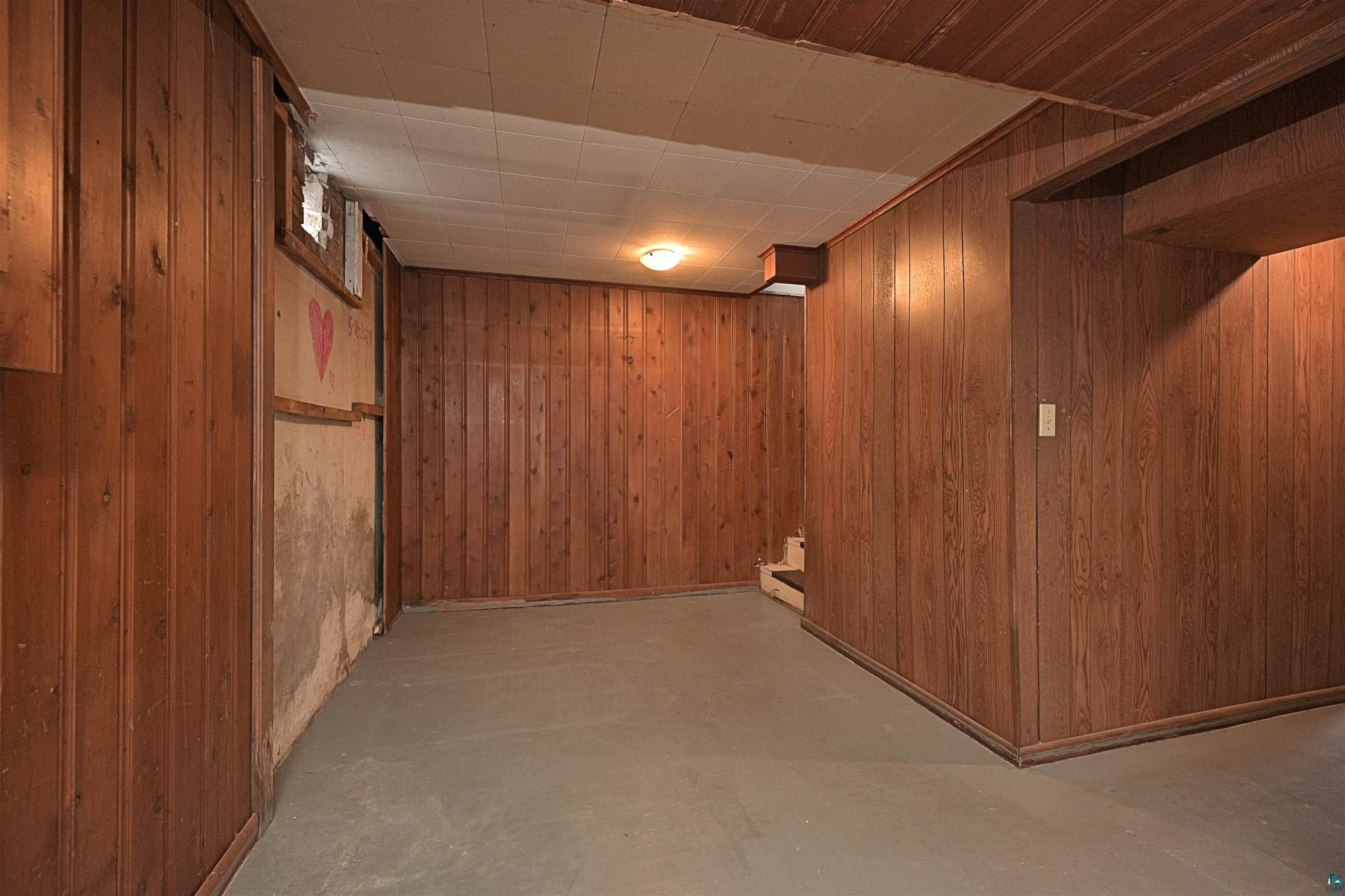 18 Banks Boulevard Silver Bay, MN 55614 - Photo 15 of 26 Finished below grade area featuring wood walls and stairs