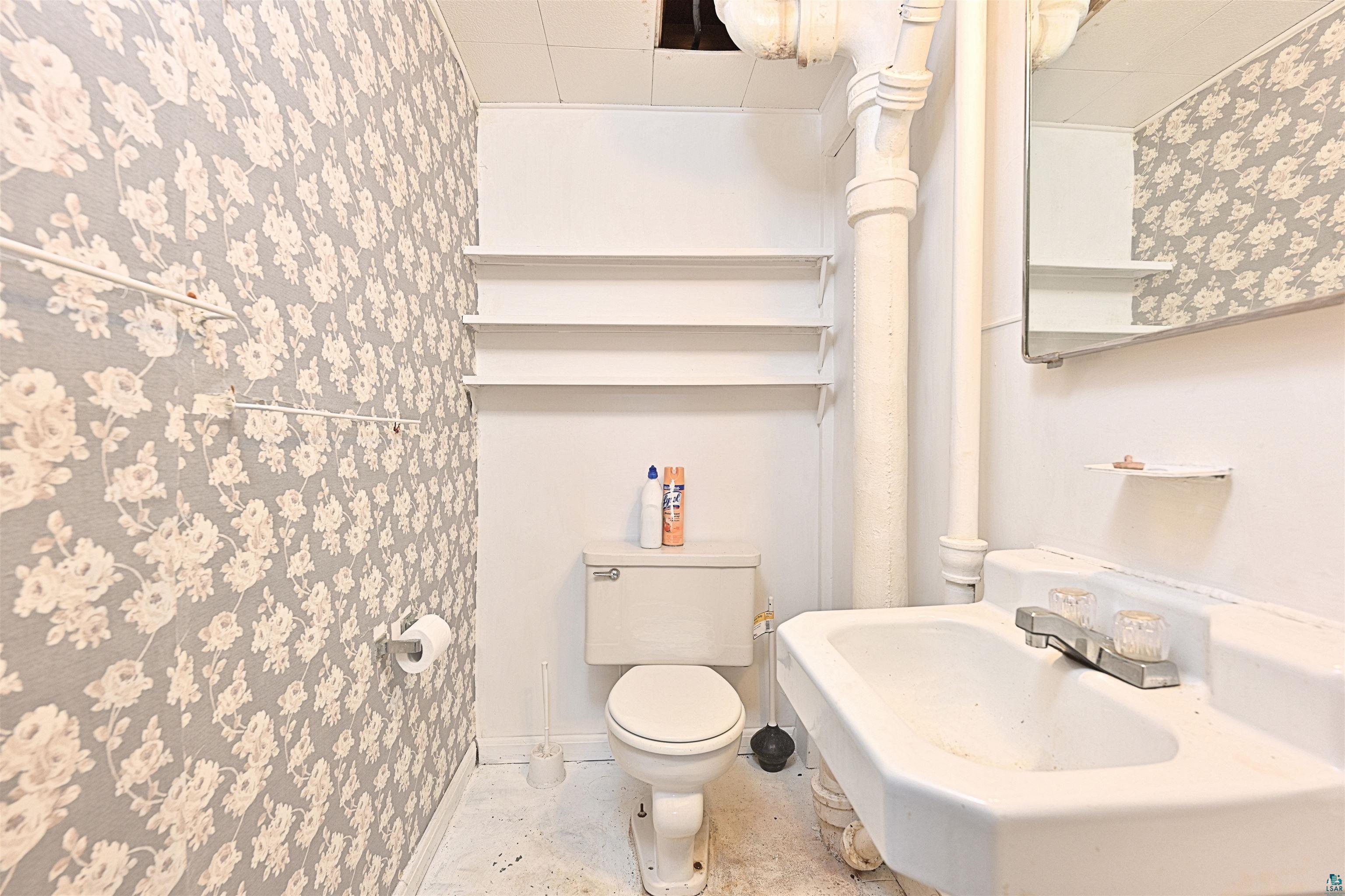 18 Banks Boulevard Silver Bay, MN 55614 - Photo 16 of 26 Half bathroom with toilet and a sink