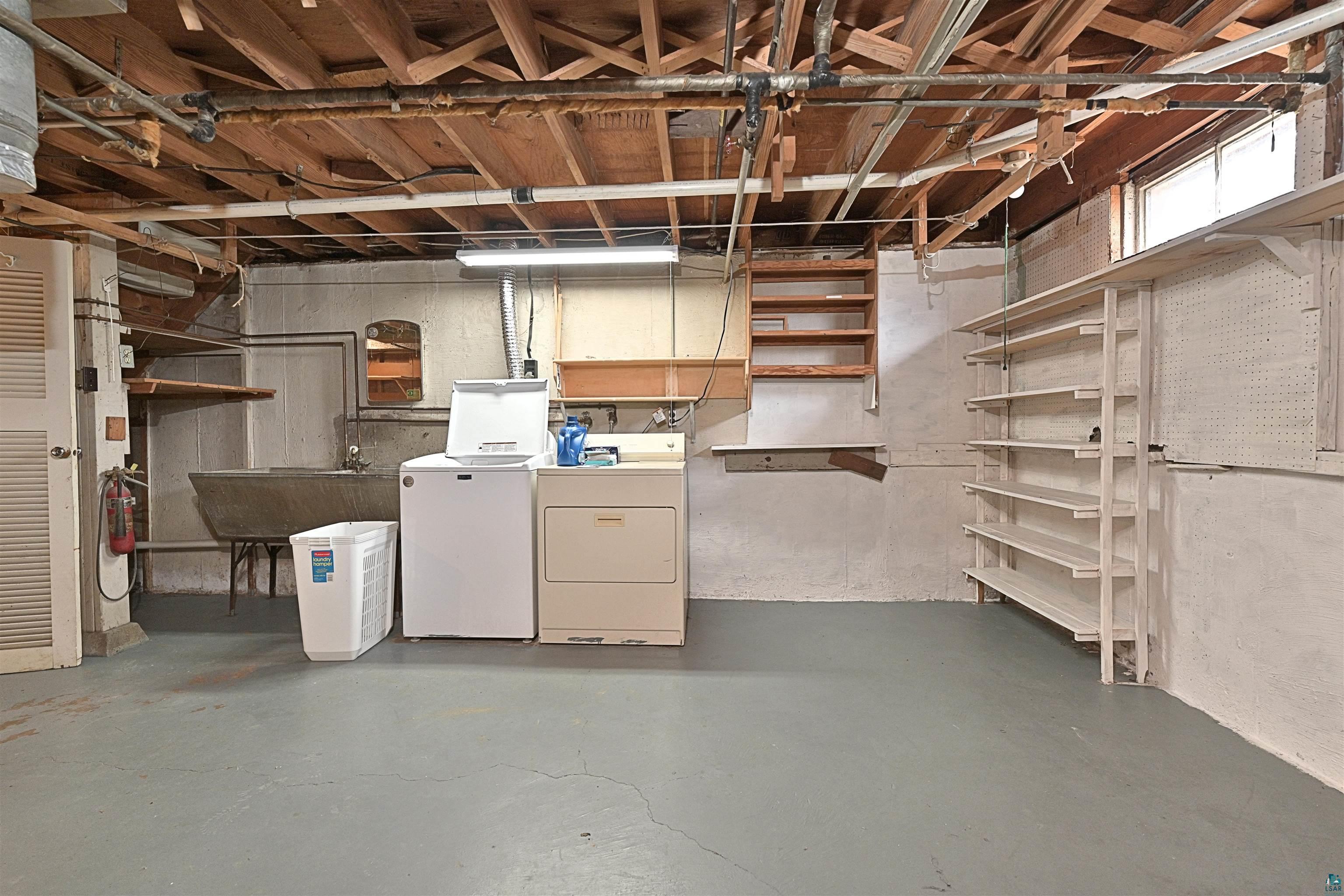 18 Banks Boulevard Silver Bay, MN 55614 - Photo 17 of 26 Basement with separate washer and dryer and a sink