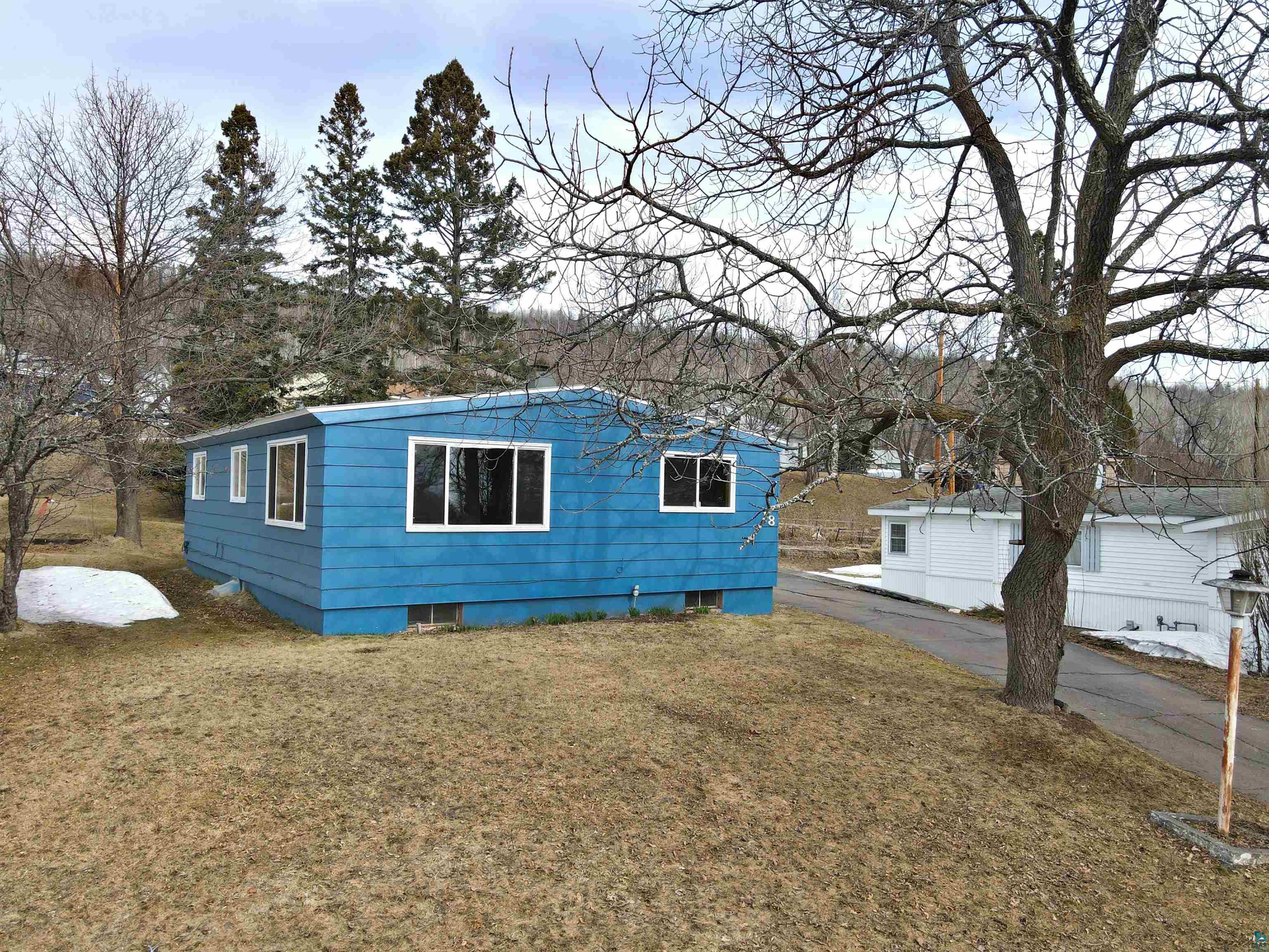 18 Banks Boulevard Silver Bay, MN 55614 - Photo 23 of 26 View of side of home with a yard