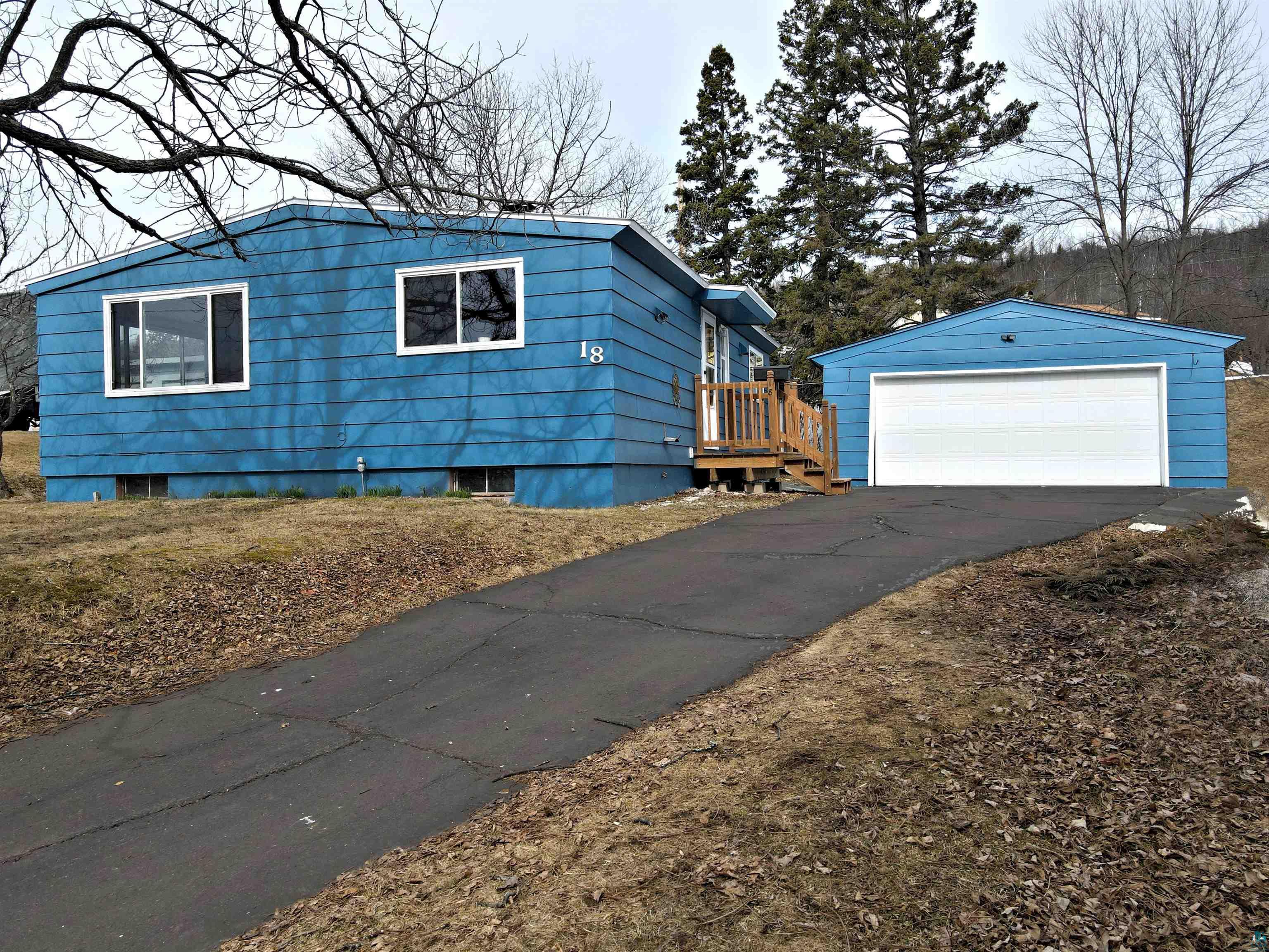 18 Banks Boulevard Silver Bay, MN 55614 - Photo 25 of 26 View of front of home with a garage and an outbuilding