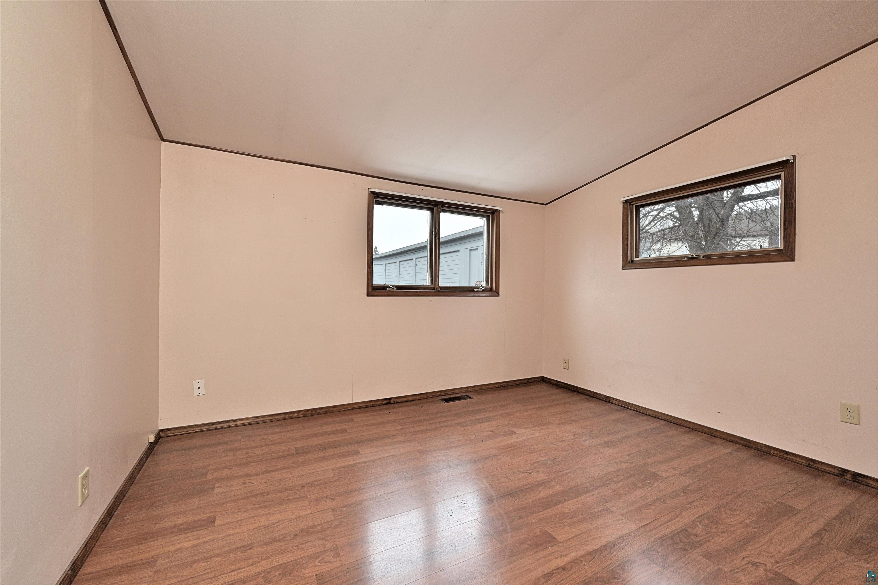 18 Banks Boulevard Silver Bay, MN 55614 - Photo 10 of 26 Spare room with lofted ceiling and wood finished floors