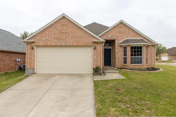 a front view of a house with yard