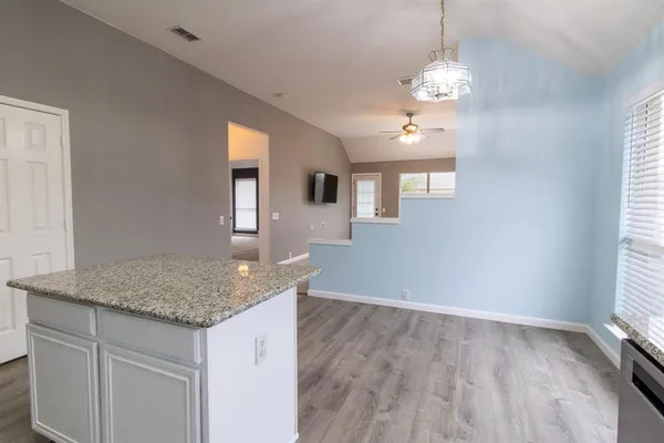 a hallway with sink and window
