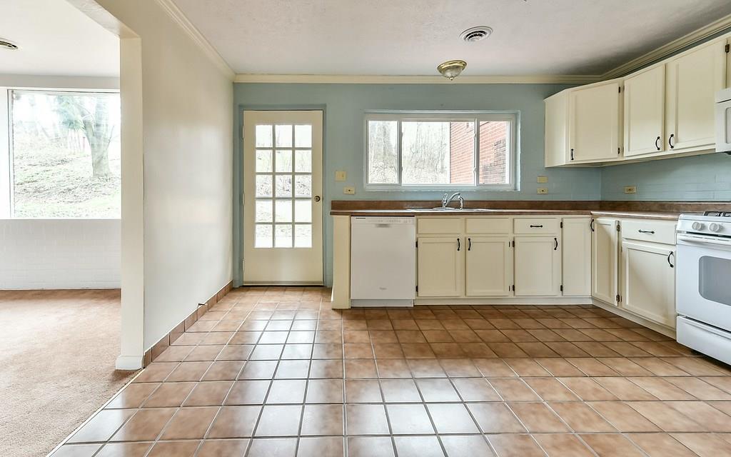 1463 Anderson Road Pittsburgh, PA 15209 - Photo 8 of 22 Both kitchen and dining room showcase the new patio and seeded yard