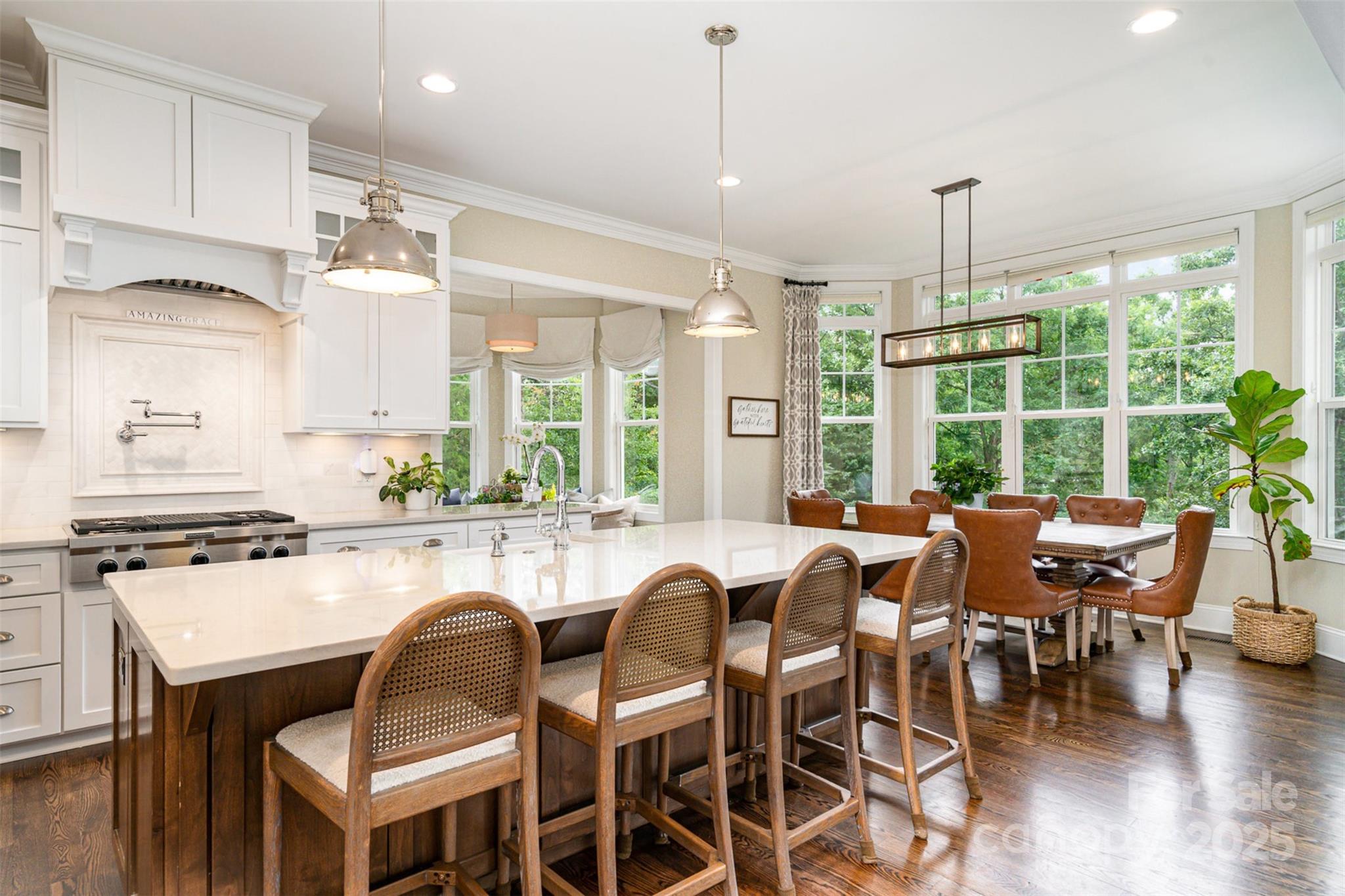 6873 Pine Moss Lane Clover, SC 29710 - Photo 11 of 46 a dining table with chairs and kitchen view