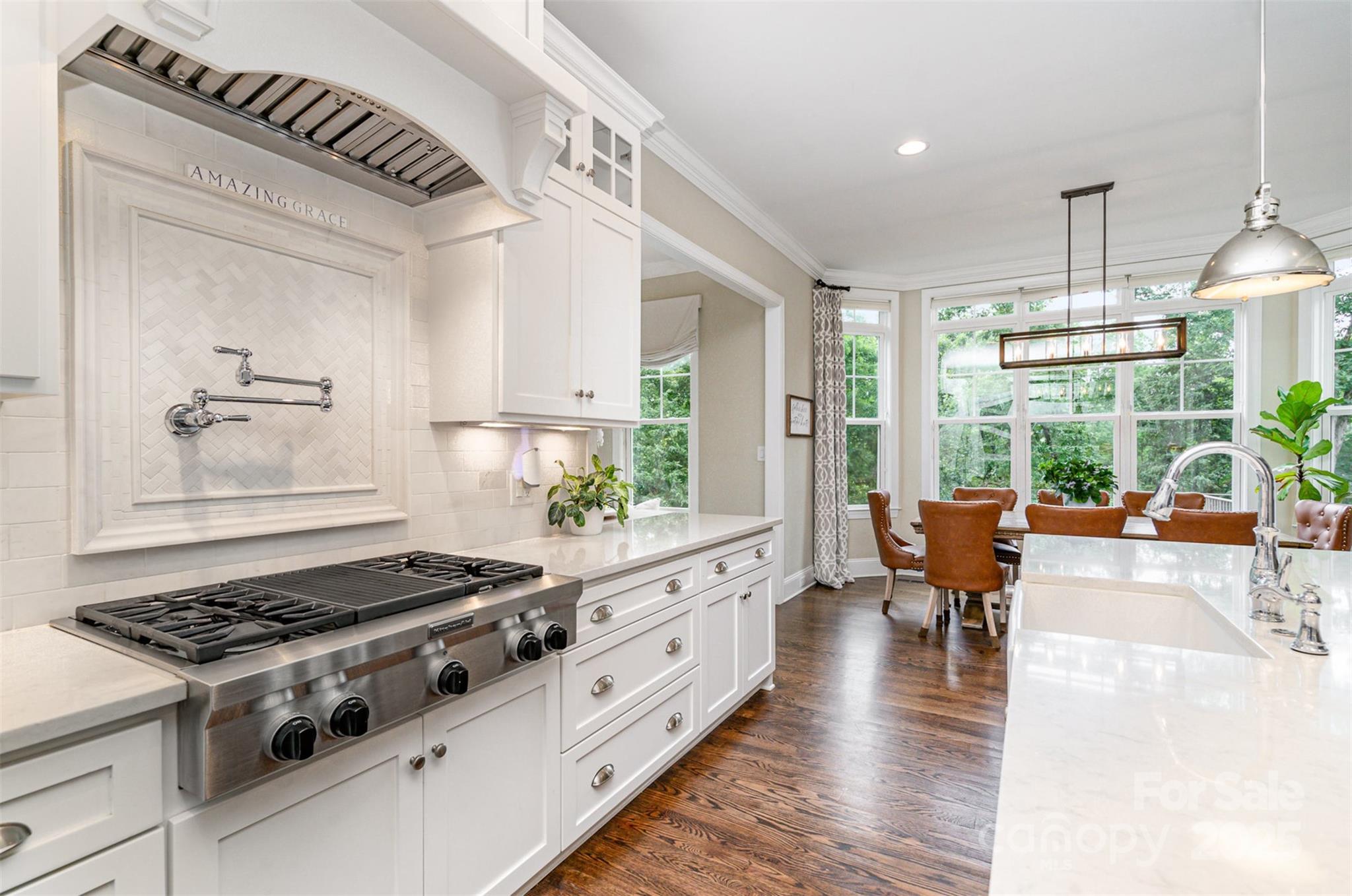 6873 Pine Moss Lane Clover, SC 29710 - Photo 12 of 46 a kitchen with stove and wooden floor