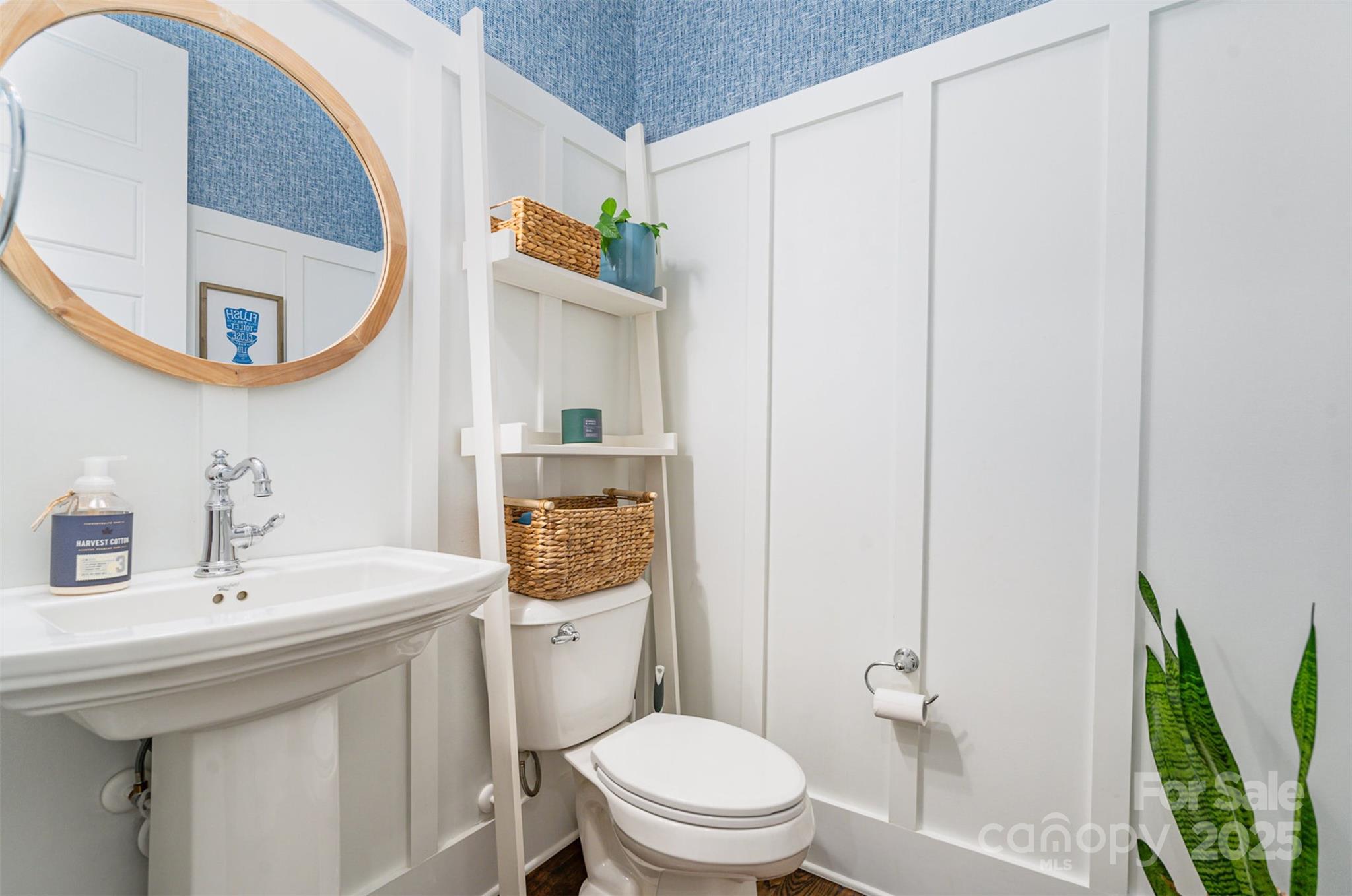 6873 Pine Moss Lane Clover, SC 29710 - Photo 21 of 46 a bathroom with a sink a toilet and a mirror