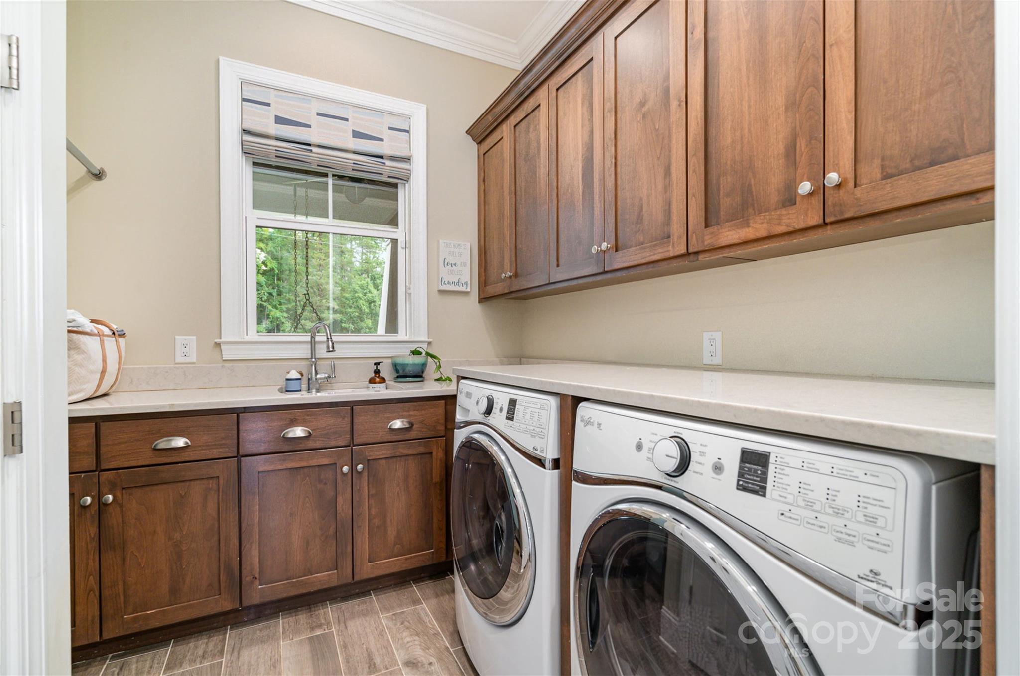 6873 Pine Moss Lane Clover, SC 29710 - Photo 22 of 46 a utility room with sink dryer and washer