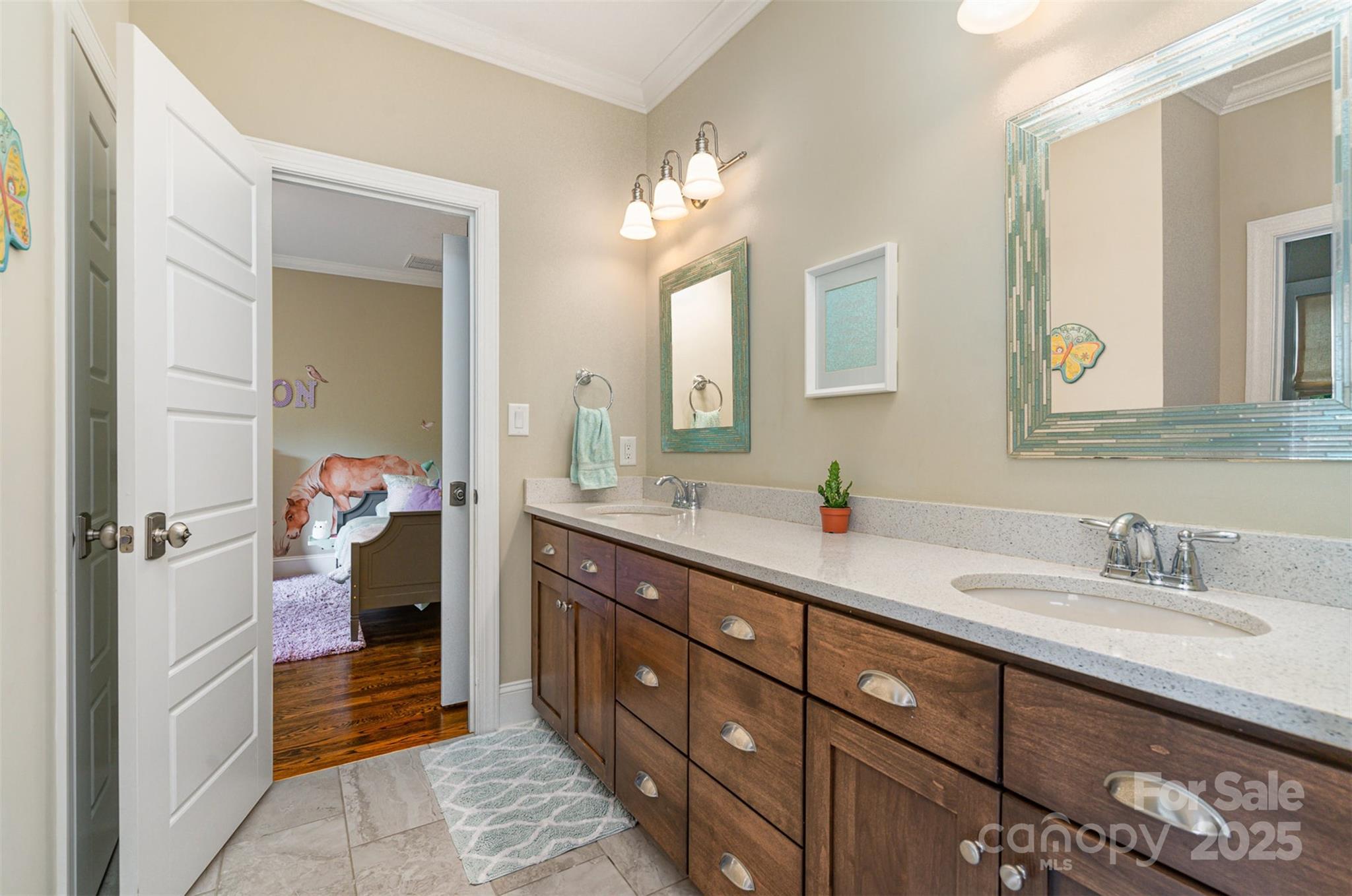 6873 Pine Moss Lane Clover, SC 29710 - Photo 24 of 46 a bathroom with a double vanity sink and a mirror