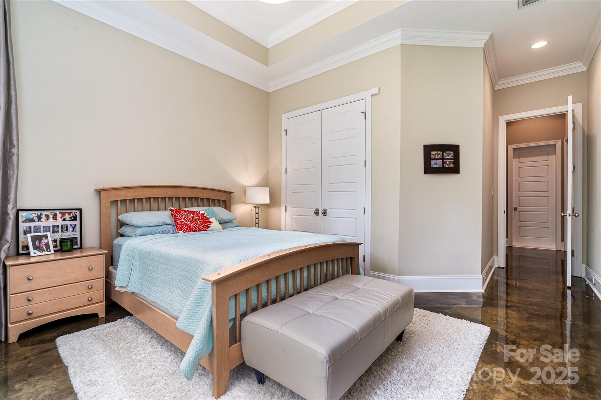 6873 Pine Moss Lane Clover, SC 29710 - Photo 35 of 46 a bedroom with a bed and wooden floor