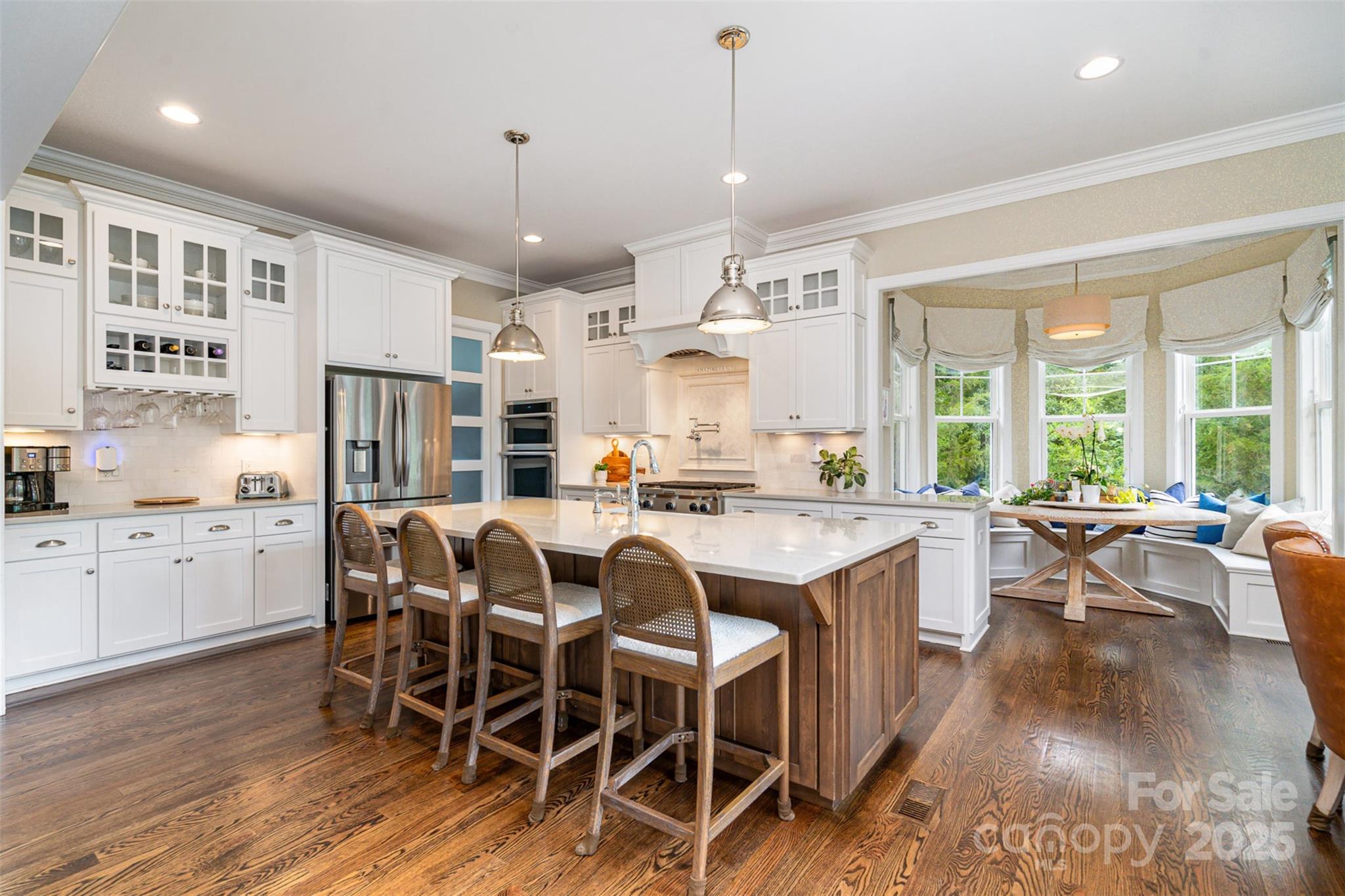 6873 Pine Moss Lane Clover, SC 29710 - Photo 10 of 46 a large kitchen with a table and chairs in it