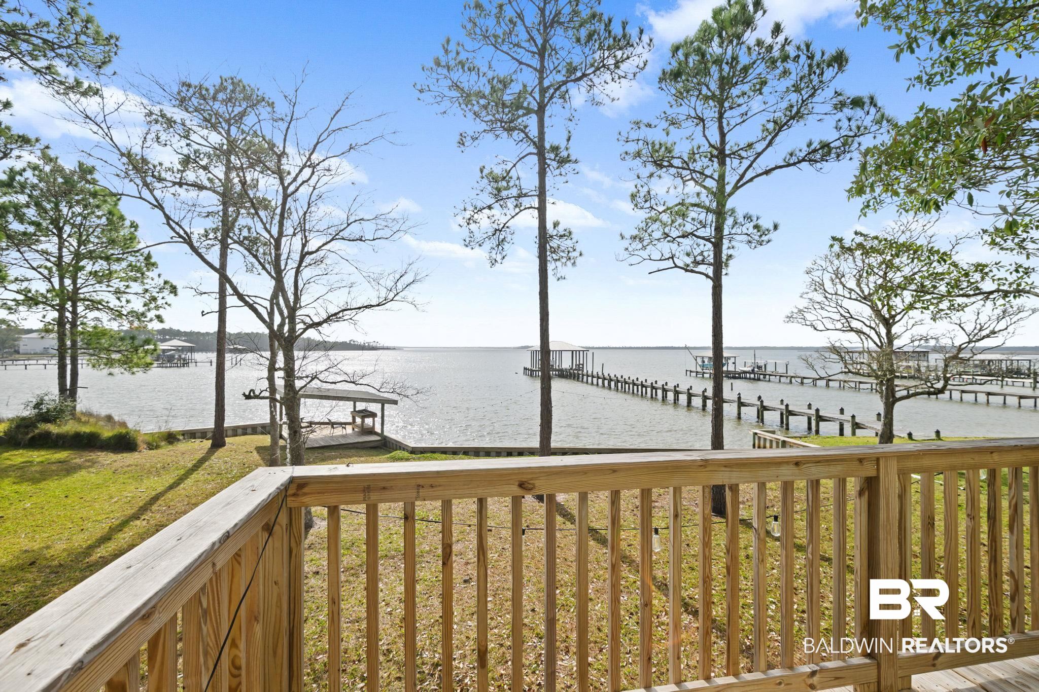 7947 Bayshore Drive Elberta, AL 36530 - Photo 10 of 26 Wooden deck with a water view, a dock, and a lawn