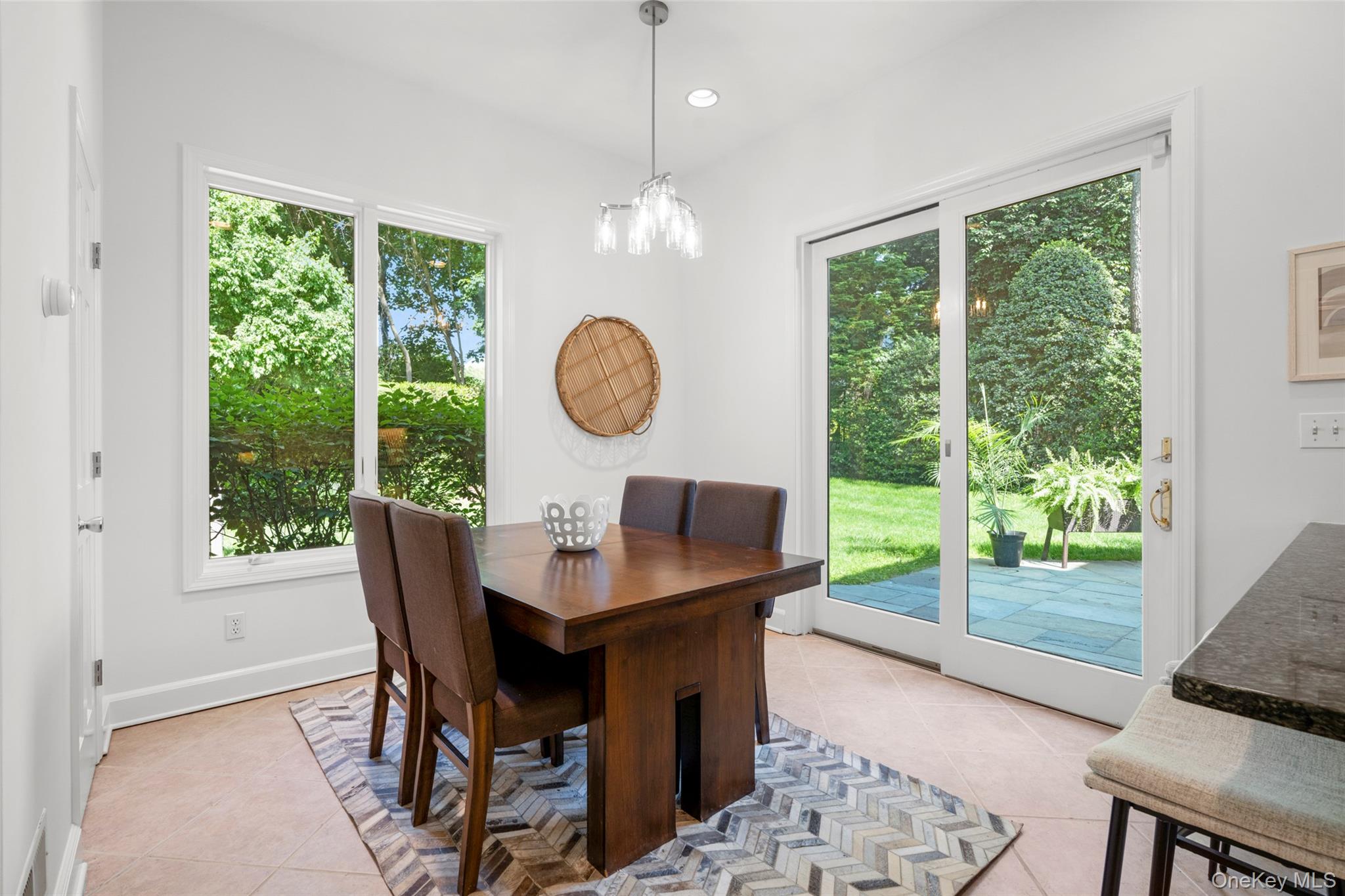 63 Rye Road Rye, NY 10580 - Photo 13 of 50 Sunny breakfast area with garden views and access to the bluestone patio.