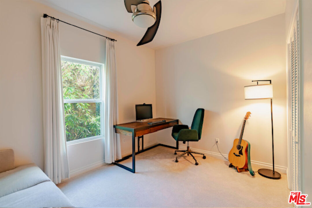 956 South Wilton Place, Unit 305 Los Angeles, CA 90019 - Photo 11 of 18 a view of a workspace with gym equipment
