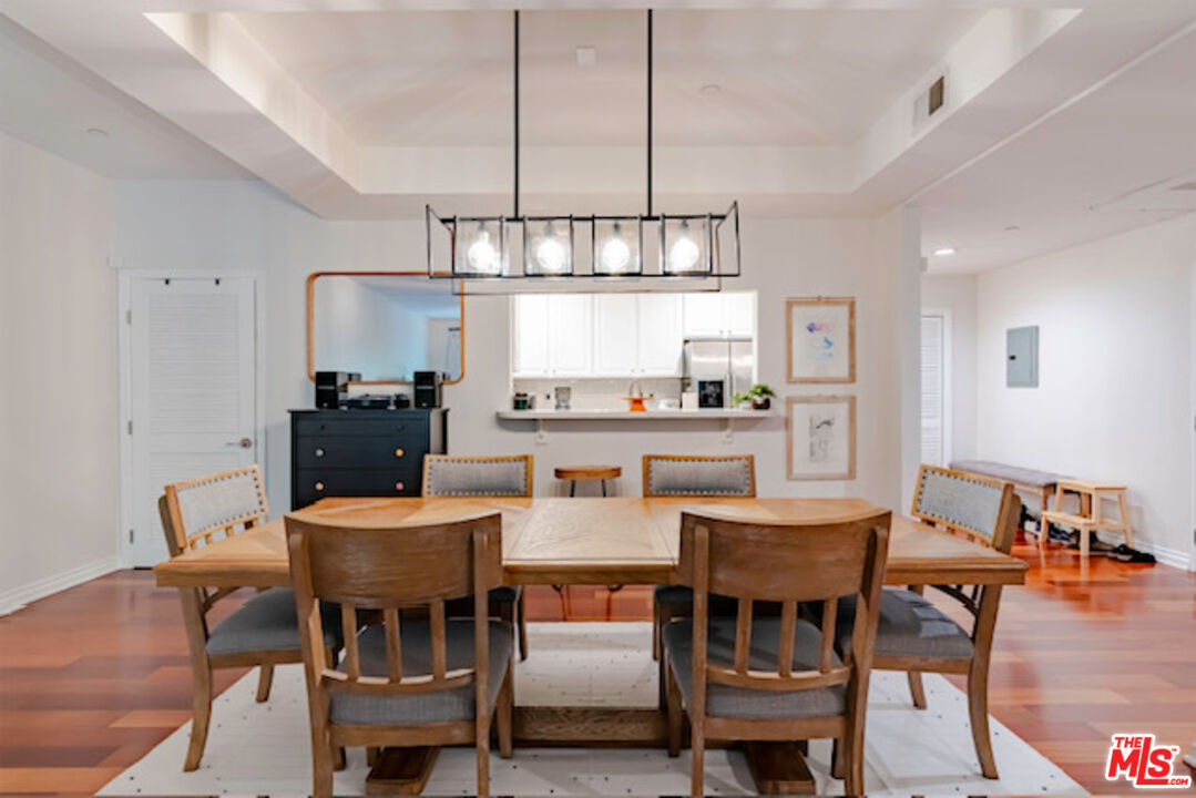 956 South Wilton Place, Unit 305 Los Angeles, CA 90019 - Photo 14 of 18 a view of a dining room with furniture