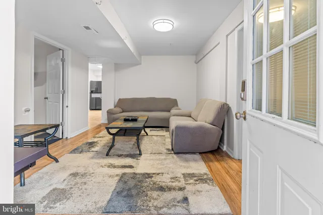 a living room with furniture and a rug