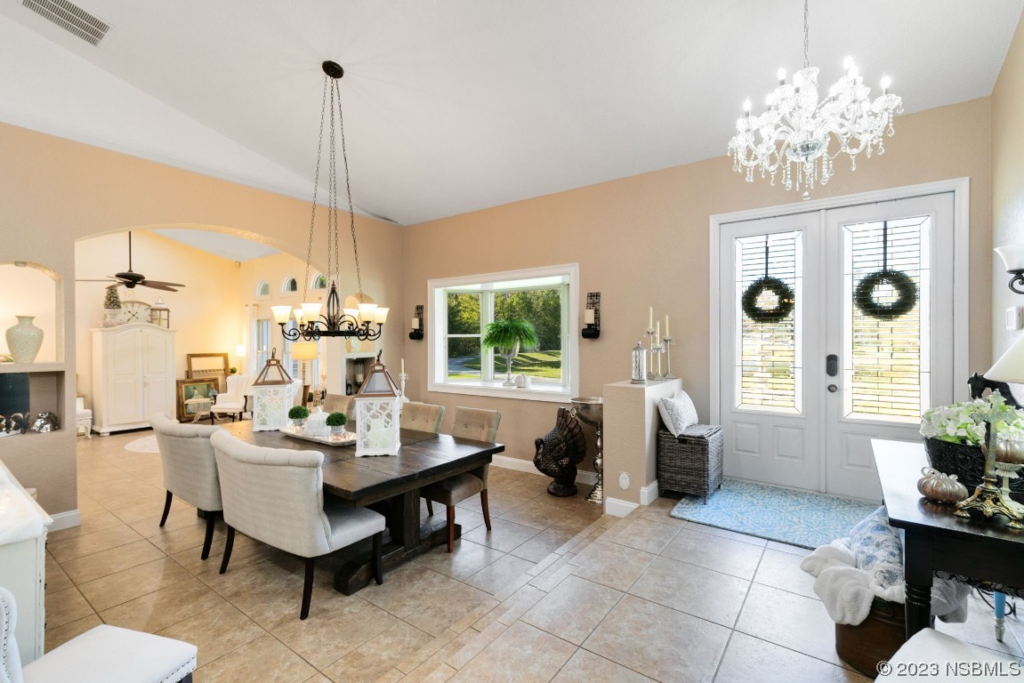 1780 Old Mission Road Edgewater, FL 32132 - Photo 14 of 55 a living room with patio furniture and a chandelier