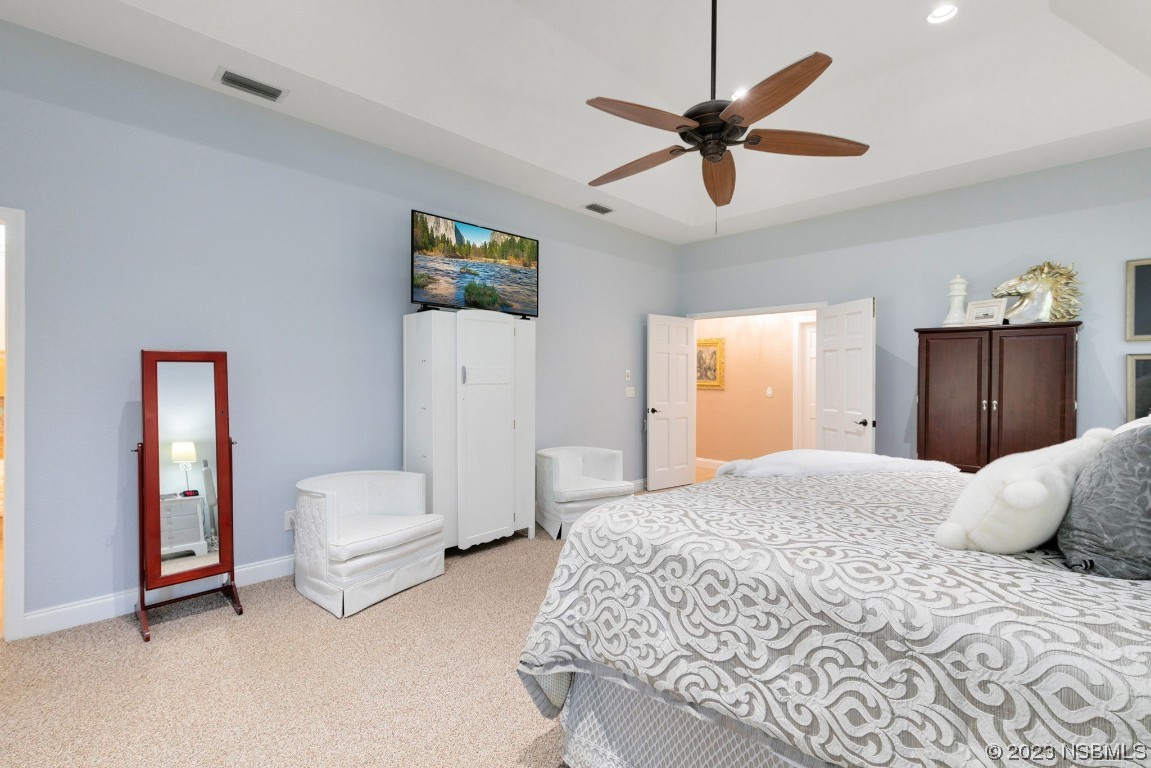 1780 Old Mission Road Edgewater, FL 32132 - Photo 20 of 55 a bedroom with a bed and ceiling fan