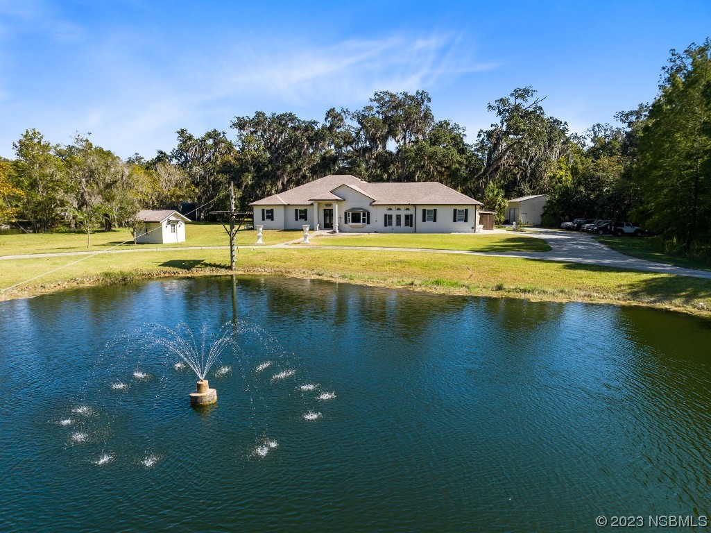 1780 Old Mission Road Edgewater, FL 32132 - Photo 2 of 55 a front view of a house with swimming pool
