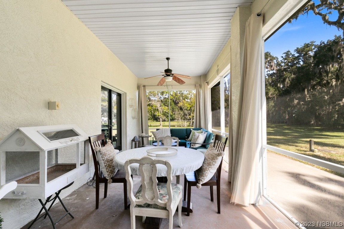 1780 Old Mission Road Edgewater, FL 32132 - Photo 23 of 55 a view of a dining room with furniture window and outside view