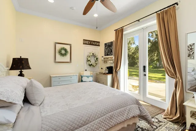 a bedroom with a large bed and a large window