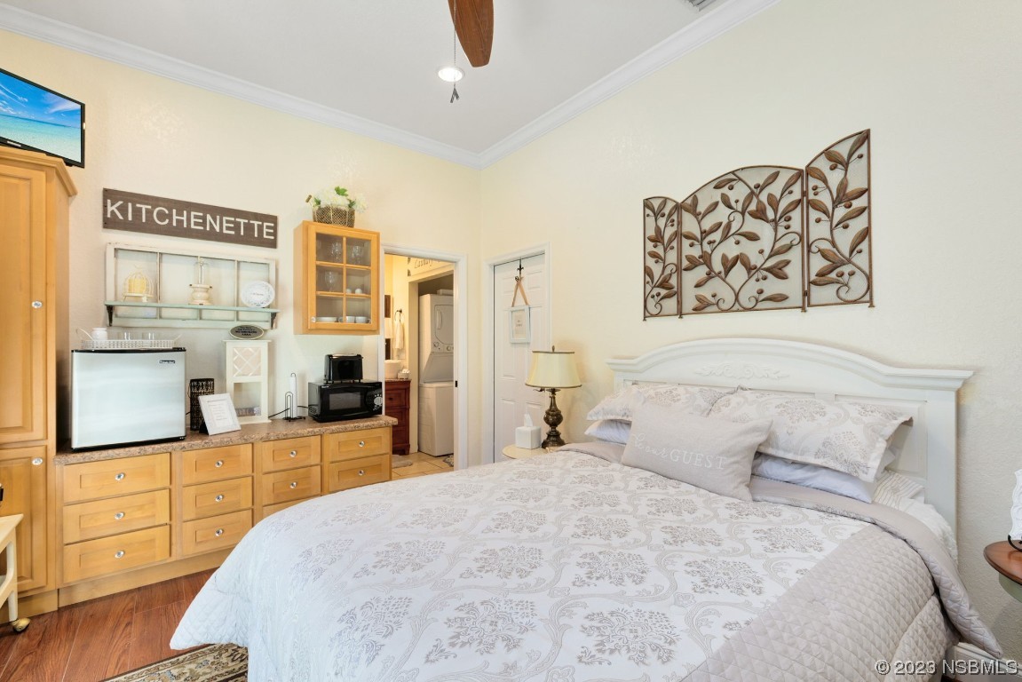 1780 Old Mission Road Edgewater, FL 32132 - Photo 26 of 55 a bedroom with a large bed and a flat tv screen on dresser