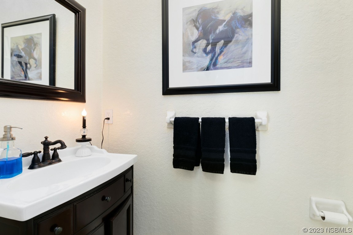 1780 Old Mission Road Edgewater, FL 32132 - Photo 30 of 55 a bathroom with a sink and a mirror
