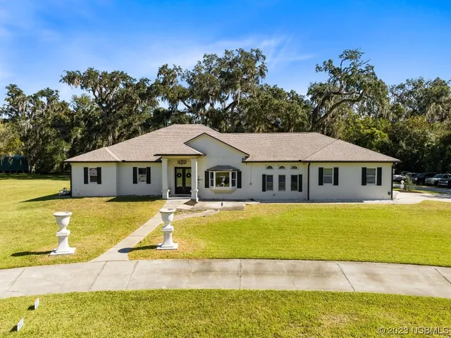 a front view of a house with swimming pool