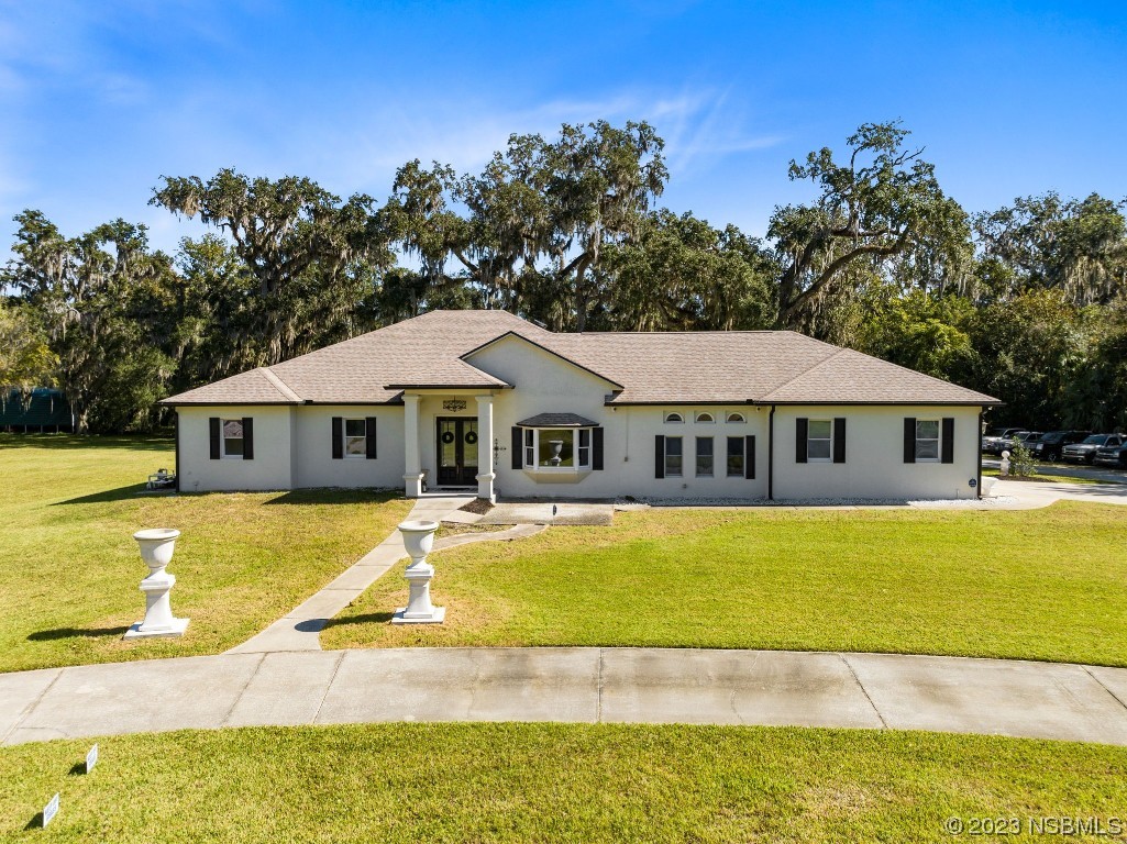 1780 Old Mission Road Edgewater, FL 32132 - Photo 3 of 55 a front view of a house with swimming pool