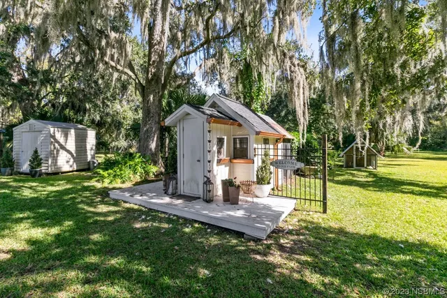 a big yard with lots of green space and trees