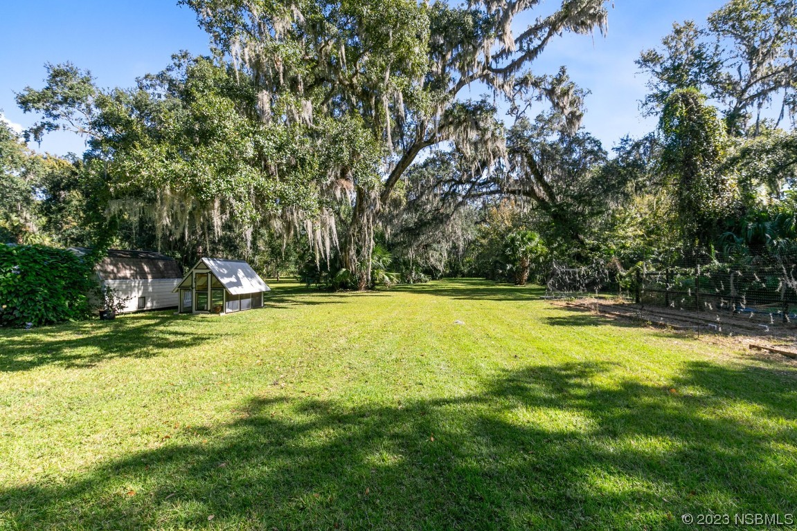 1780 Old Mission Road Edgewater, FL 32132 - Photo 37 of 55 a view of a swimming pool with a yard